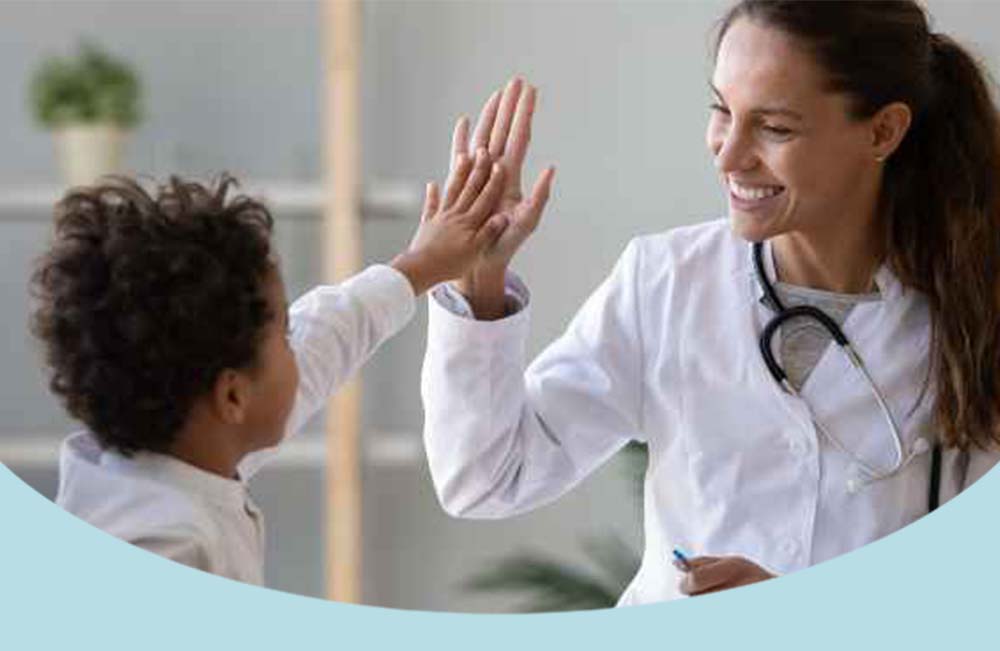Doctor high fiving child patient