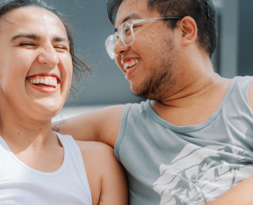 Man and woman sitting together and laughing