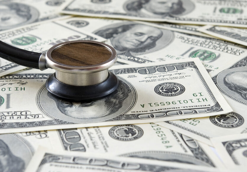 Stethoscope on a money background of dollars