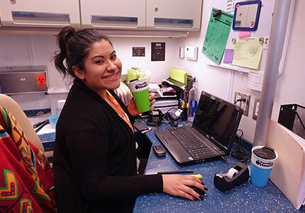an image of a Peach Tree employee hard at work at her work station
