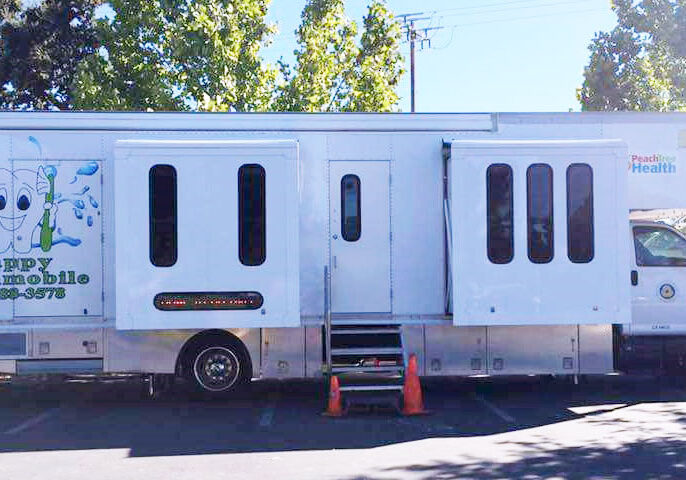 an image of the Peach Tree Health Happy Toothmobile Clinic